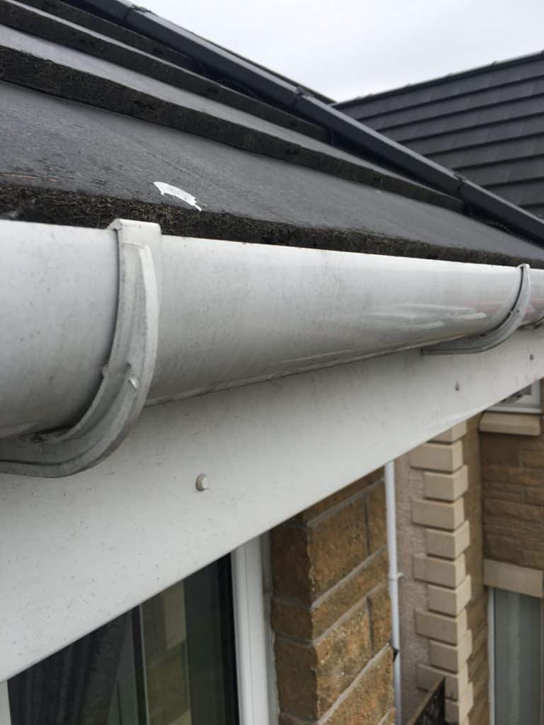 Blocked gutter cleared and flushed in Glenmavis — same gutter after clearing