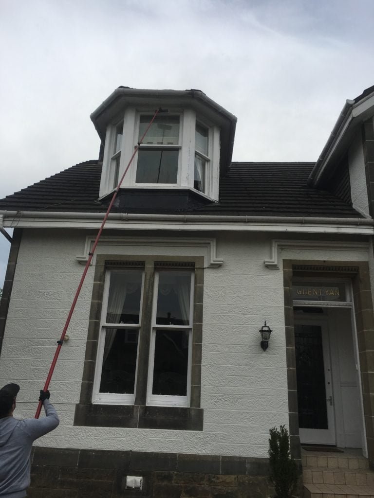 Window cleaning in Milngavie with a water-fed pole