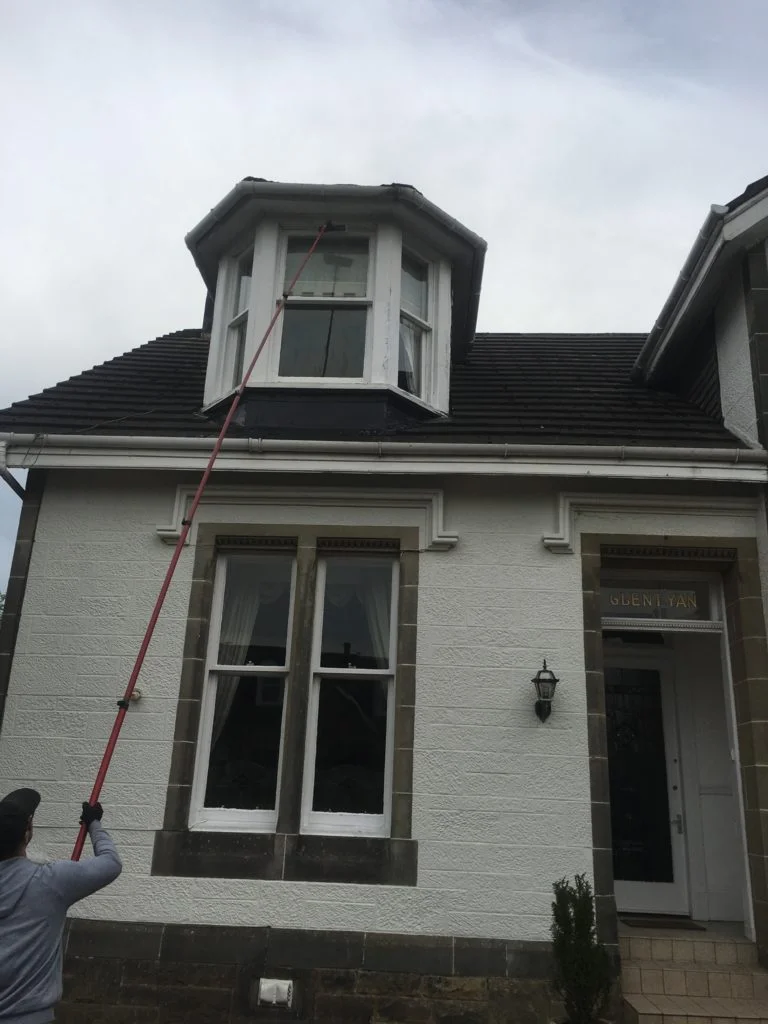 Window cleaning in Milngavie with a water-fed pole