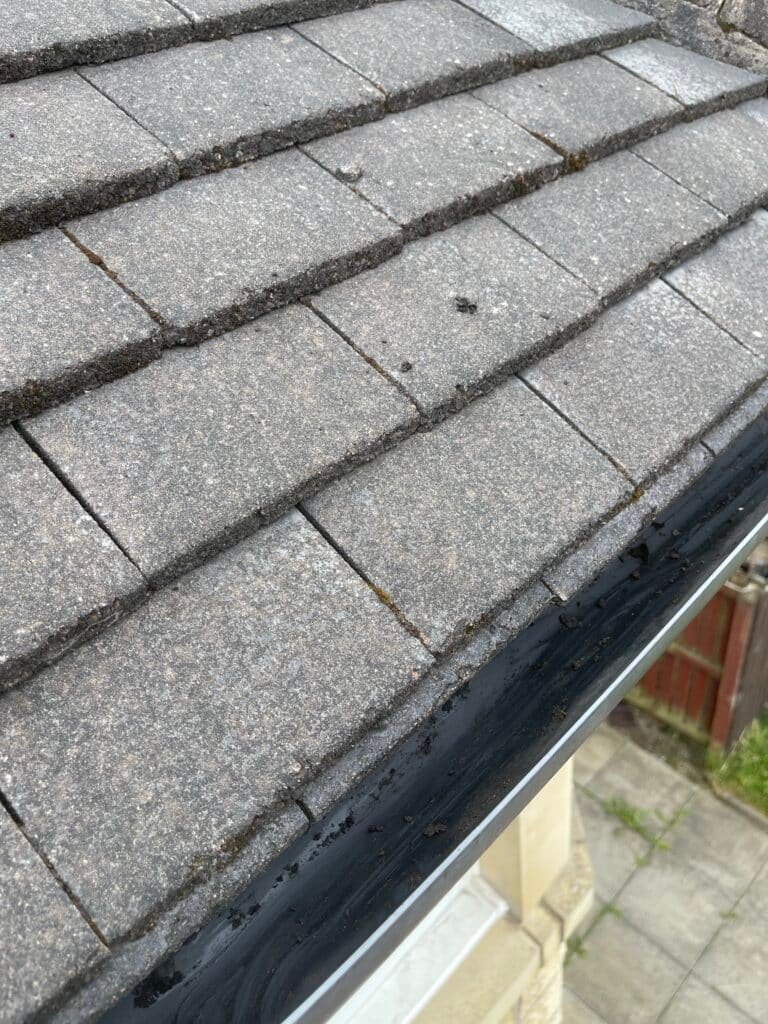 Roof tiles meeting the gutter line on a house in Airdrie
