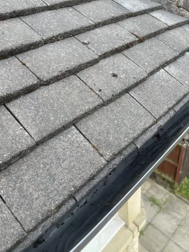 Roof tiles meeting the gutter line on a house in Airdrie