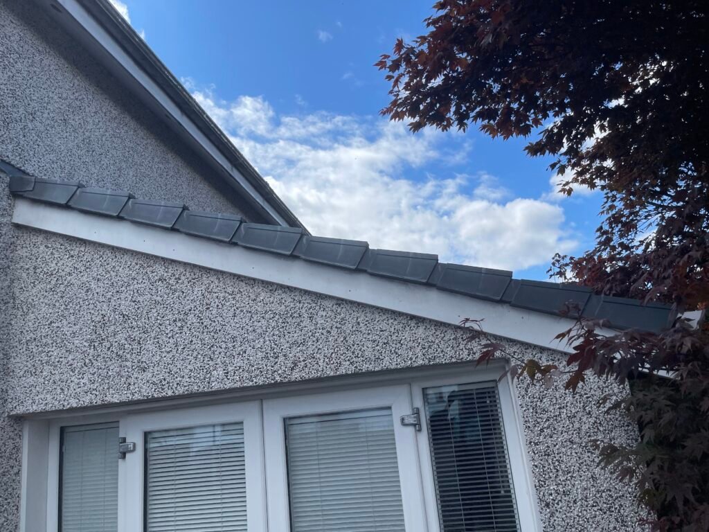 White UPVC soffit and fascia under the eaves of an Airdrie home